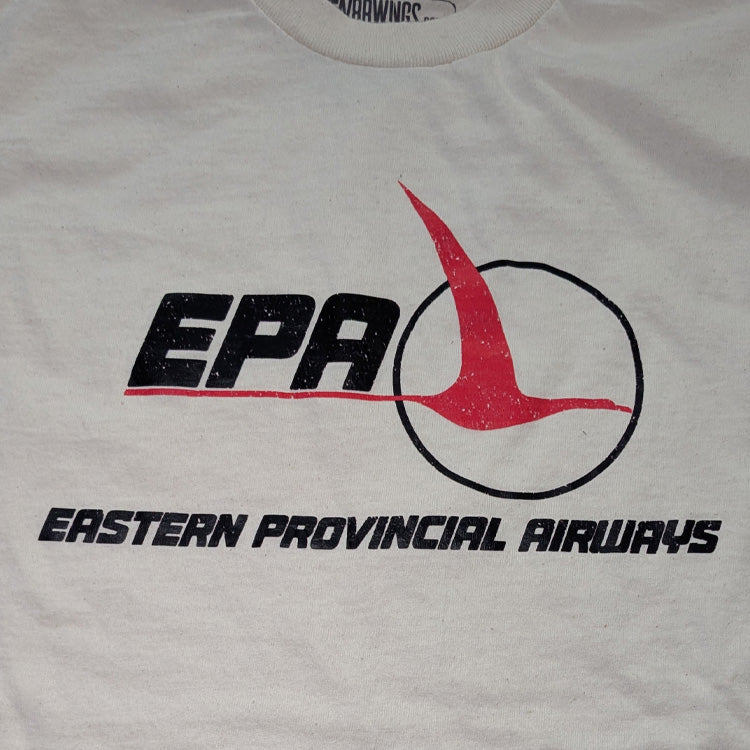 A close-up of an antique white t-shirt featuring the distressed black and red Eastern Provincial Airways (EPA) logo and text on the front.