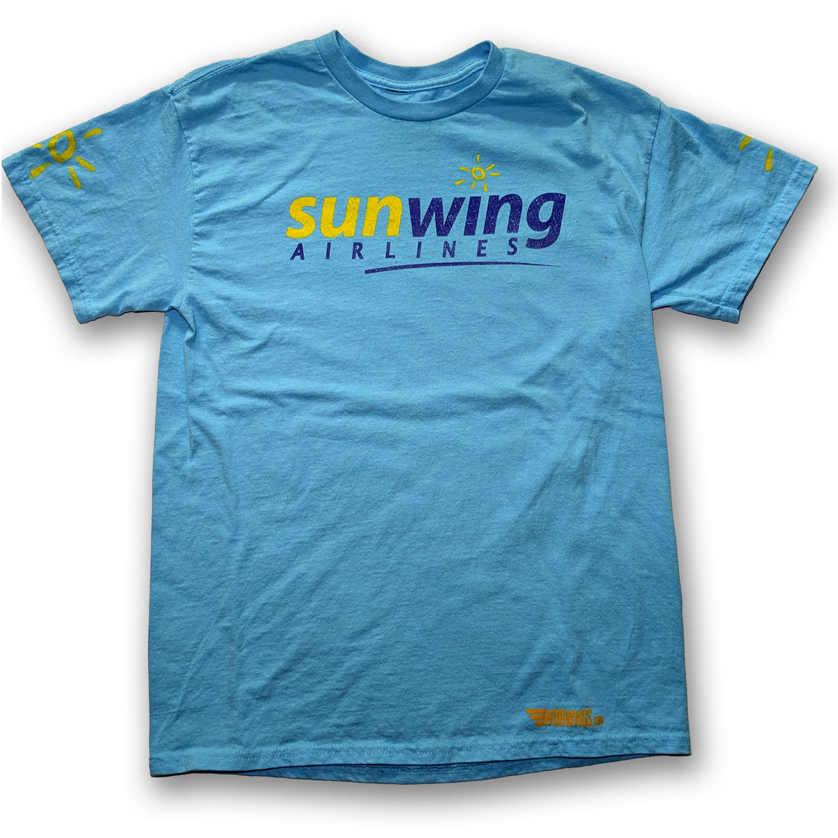 A light blue crewneck t-shirt featuring the 'sunwing AIRLINES' logo printed across the chest in yellow and dark blue, with small yellow sun graphics on both sleeves.